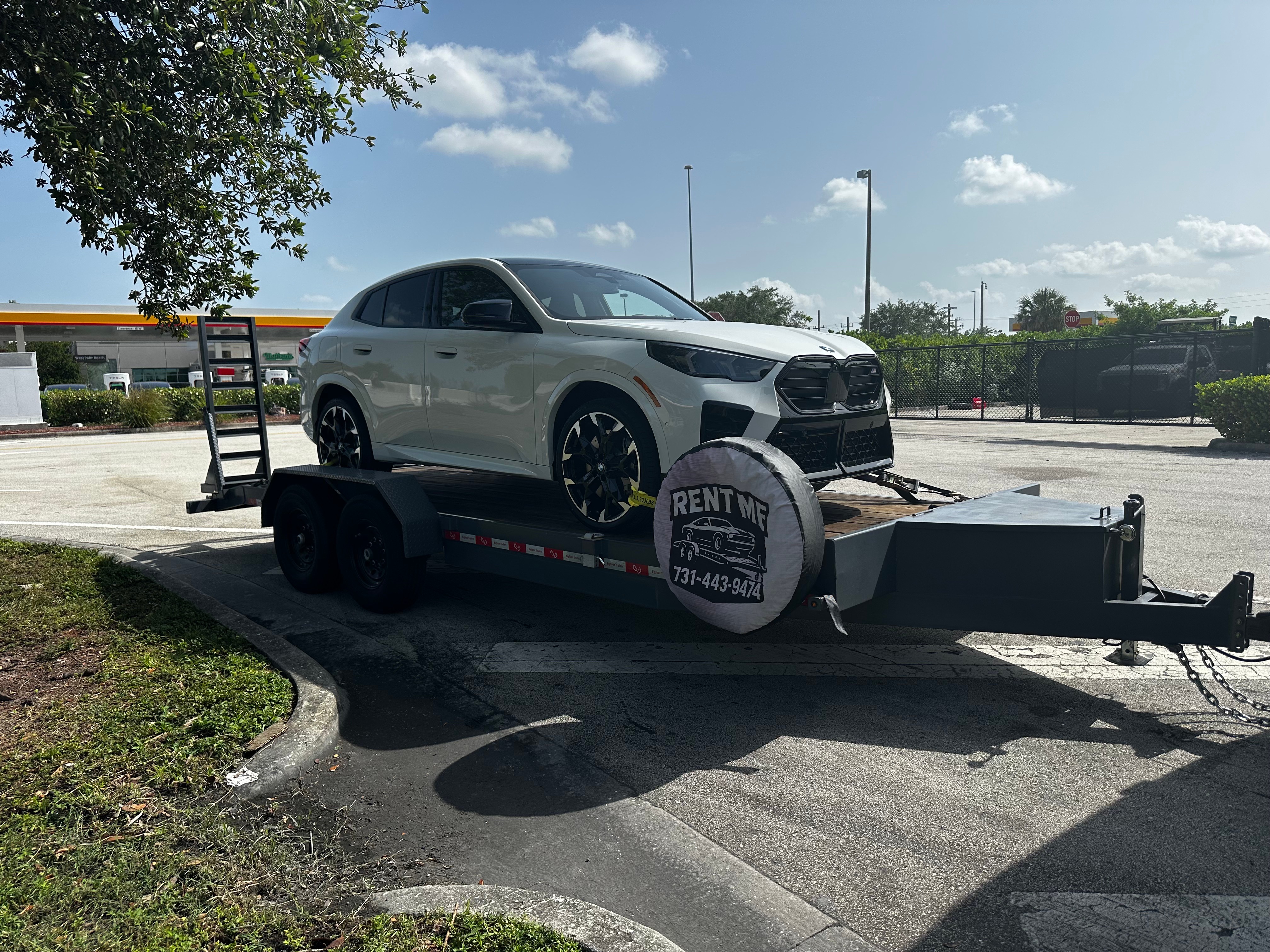 BMW SUV loaded on Grace and Grit car hauler trailer